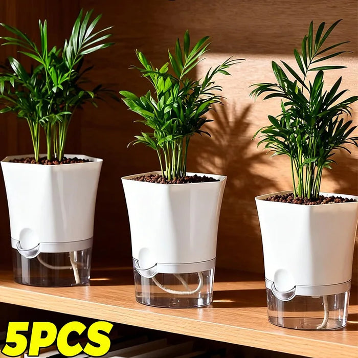 Self-watering plant pot with cotton wick water reservoir